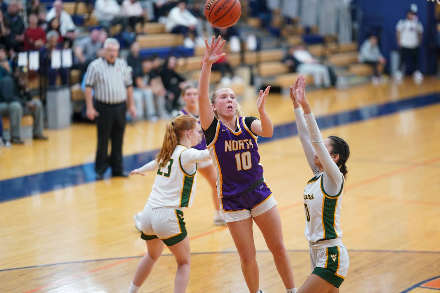 Downers Grove North's Hope Sebek (10) shoots the ball over Waubonsie Valley's Maya Pereda (0) during a Oswego semifinal sectional 4A basketball game at Oswego High School on Tuesday, Feb 20, 2024.