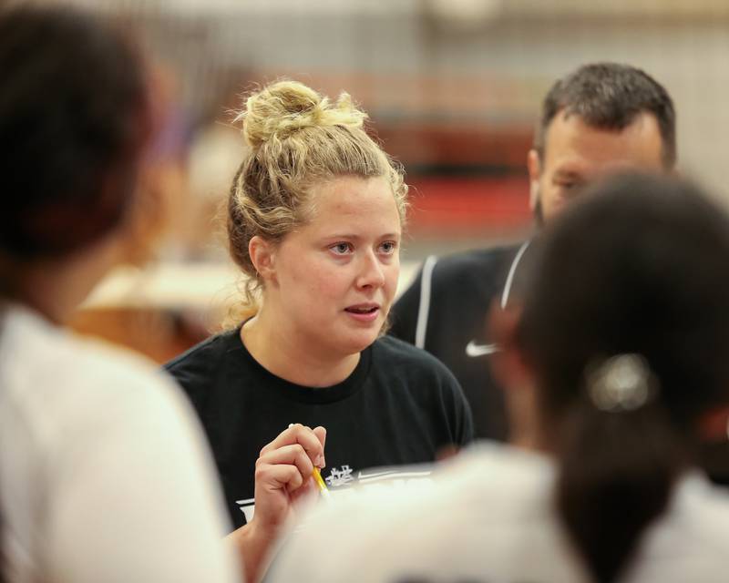 Plano's head coach Brittany Hill instructs the team during a timeout in their volleyball match versus Sandwich. August 21, 2023.