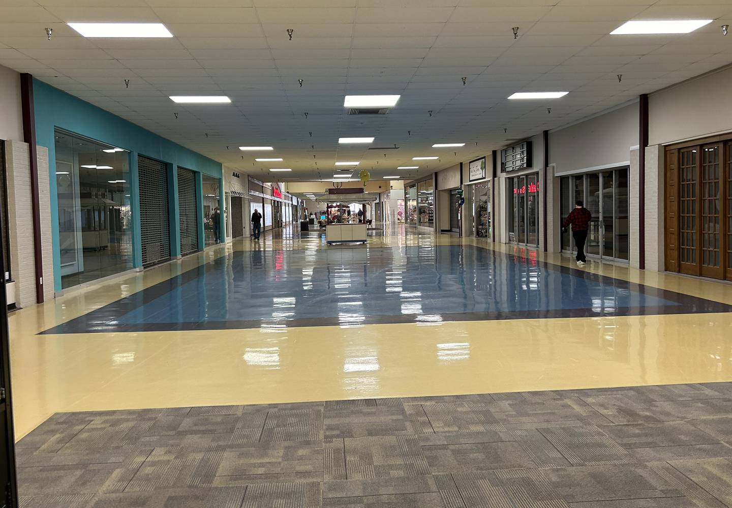 Walkers take advantage of the open space at the Northland Mall in Sterling on Thursday, Feb. 8., 2024. Two more stores, Maurices and Bath & Body Works, have left Nortland Mall and moved across the street to Sterling Crossing. Dunham Sports and a handful of stores remain open in the mall.