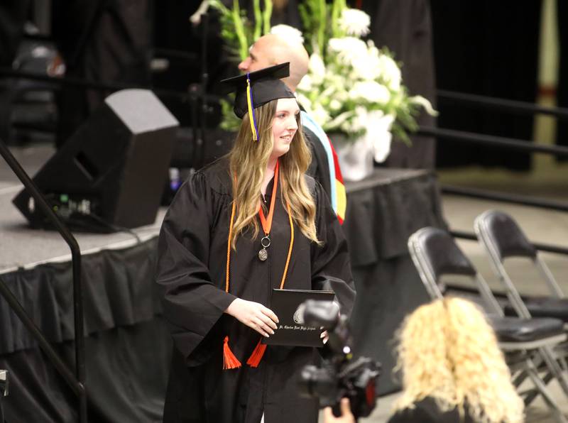 St. Charles East graduate Madeline Spaeth crosses the stage with her diploma during the school’s 2024 commencement ceremony at Northern Illinois University in DeKalb on Monday, May 20, 2024.