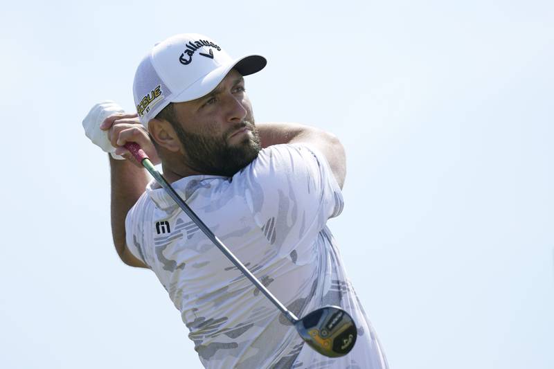 Jon Rahm, of Spain, plays from the 3rd tee during the third round of the British Open golf championship on the Old Course at St. Andrews, Scotland, Saturday July 16, 2022. (AP Photo/Alastair Grant)