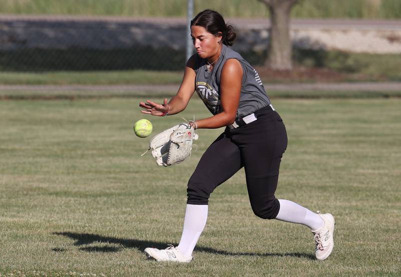 Emma Hart, a Kishwaukee Valley Storm 17u and DeKalb High School softball player, takes fields a ball in the outfield Wednesday, June 26, 2024, during 17u practice at the Sycamore Community Sports Complex. The team is preparing for this weekend’s Storm Dayz softball tournament at the complex which draws dozens of teams from throughout the area.