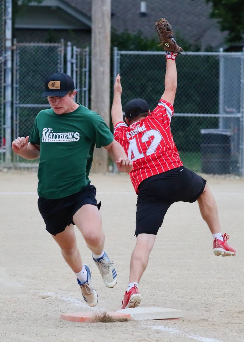 St. Matthews' Casey Etheridge beats a throw to first base in Tuesday's Princeton Park District Fastpitch tournament championship action.