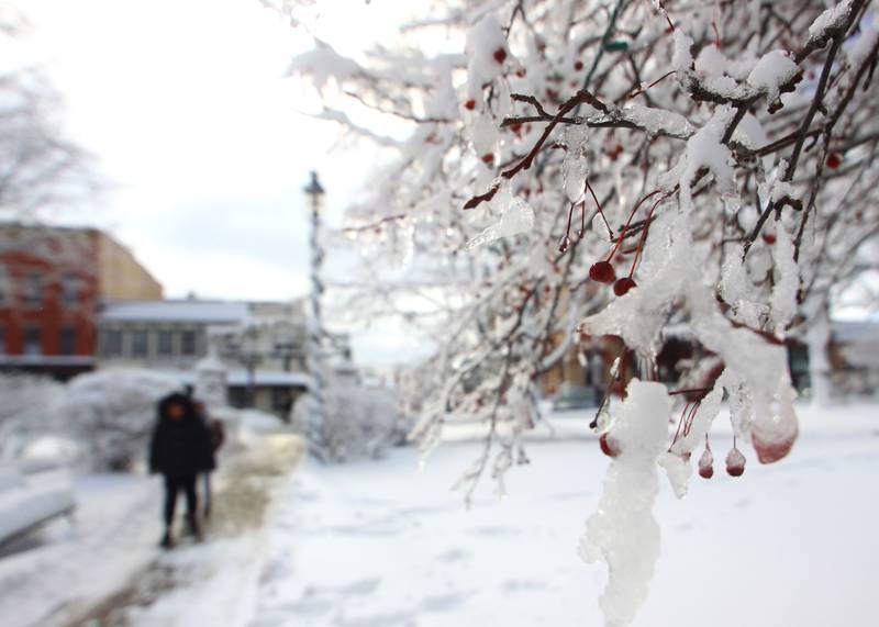 The Woodstock Square is covered Saturday in the wake of overnight snow. Bitter cold is expected to worsen into Sunday, the National Weather Service warned.