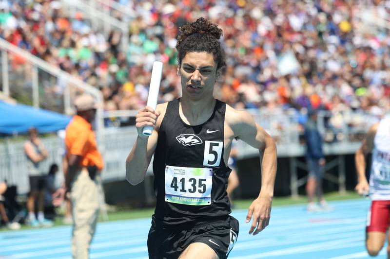 Plainfield South’s Camyn Viger rounds a turn in the Class 3A 4x800-meter relay Saturday, May 25, 2024, in Charleston at the IHSA State Meet.