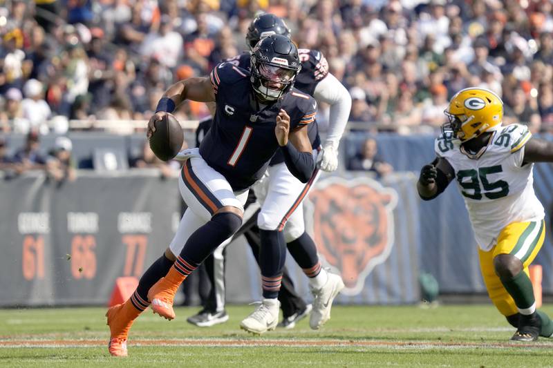 Chicago Bears quarterback Justin Fields scrambles against the Green Bay Packers Sunday, Sept. 10, 2023, in Chicago.