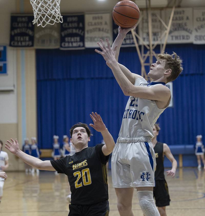 Newman’s Lucas Simpson puts up a shot against AFC Monday, Feb. 19, 2024 in a regional quarterfinal game at Newman High School.