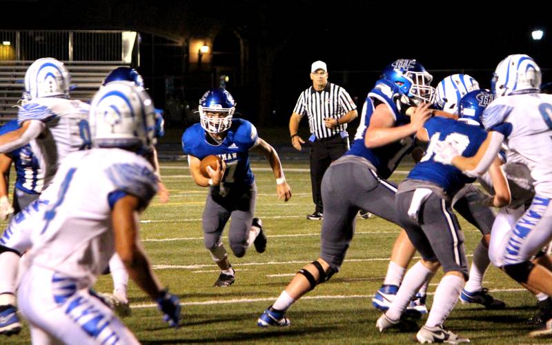 Newman’s Carter Rude runs with the ball during a home game against Princeton on Friday, Sept. 8, 2023.