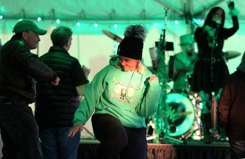 Mary Nallen of Wheeling grooves to the sounds of the Vinyl Goldmine musical group at the ShamROCKS the Fox Festival in McHenry Friday, March 17, 2023.