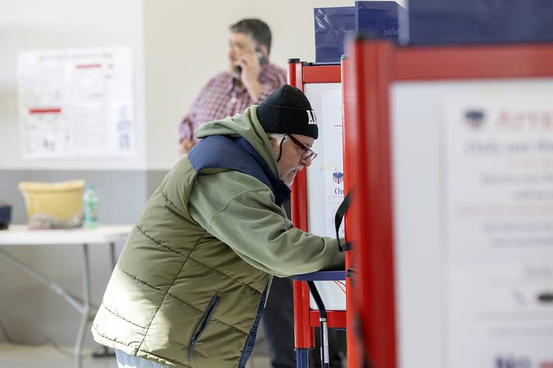 David Ortiz fills out his ballot Tuesday, March 19, 2024 in Rock Falls for the spring primary.