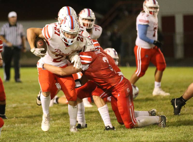 Ottawa's Derek Hoffman runs the ball as Streator's Jake Hagie brings him down on Friday, Sept. 6, 2024 at Doug Dieken Stadium.