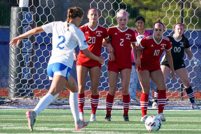 Naperville Central's Emerson Burke (20),Chloe Mowry (2) and Lauren Thorne (10) form a wall to defend against a free kick by St. Charles North's Kayla Floyd (2) during a Class 3A St. Charles North Supersectional soccer final match at St. Charles North High School on Tuesday, May 28, 2024.