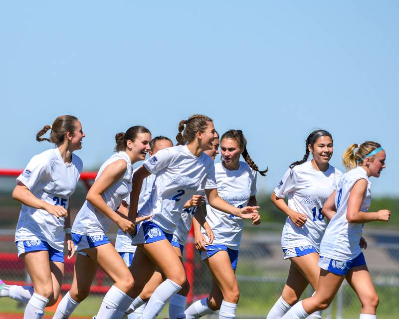 St. Charles North's Kayla Floyd (2)  gets congratulated by teammates after scoring a goal against Wheaton North during the sectional title game held on Saturday May 25, 2024 at South Elgin High School.