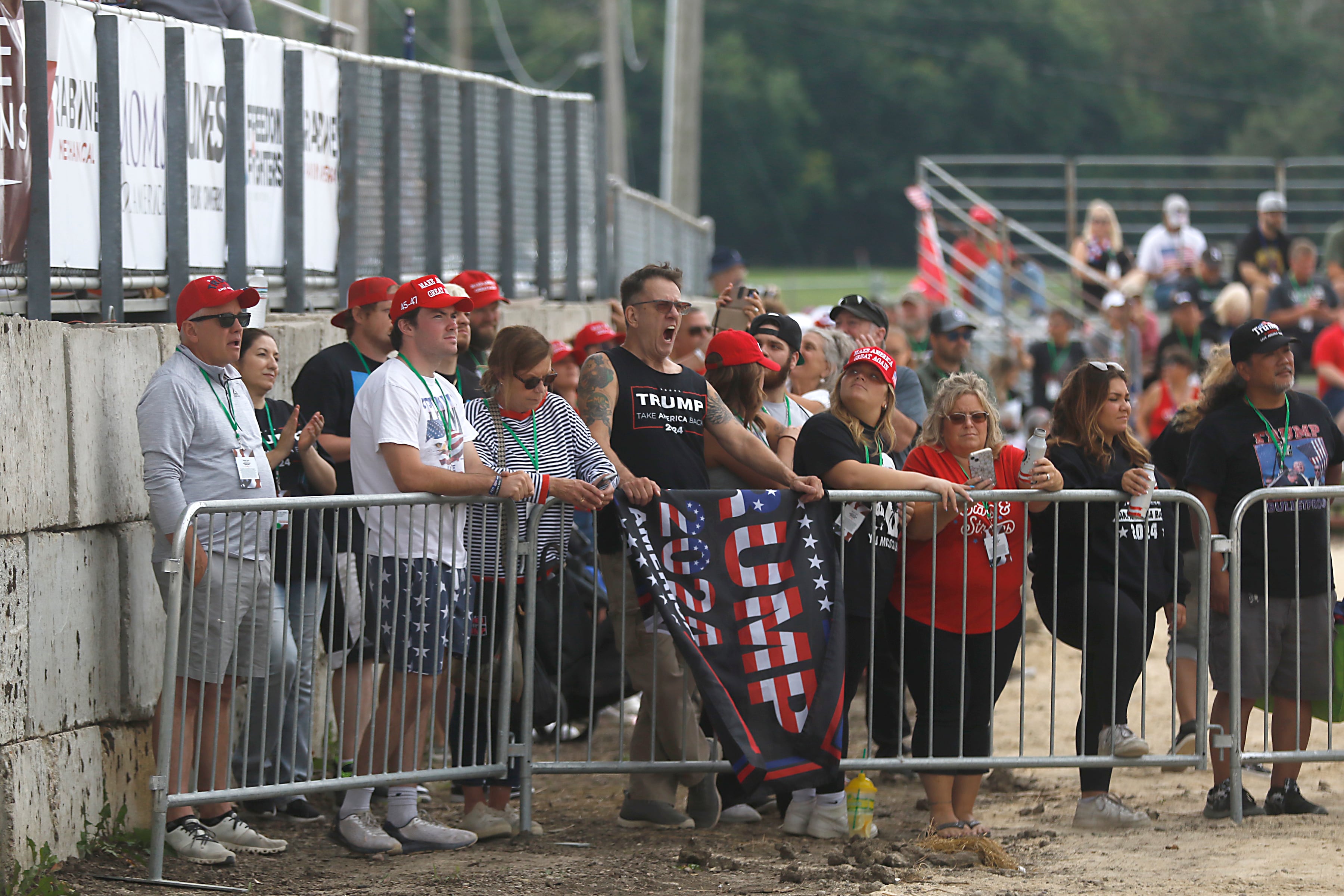 People listen to speakers during the Trump Now-Save the American Dream Rally at the McHenry County Fairgrounds on Sunday Aug. 18, 2024, in Woodstock.