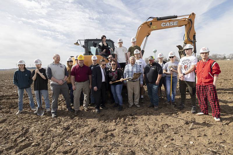 Developers, contractors and WACC students pose for a photo at one of two areas in Rock Falls Tuesday, Feb. 27, 2024 where dozens of single family homes are slated to be built.