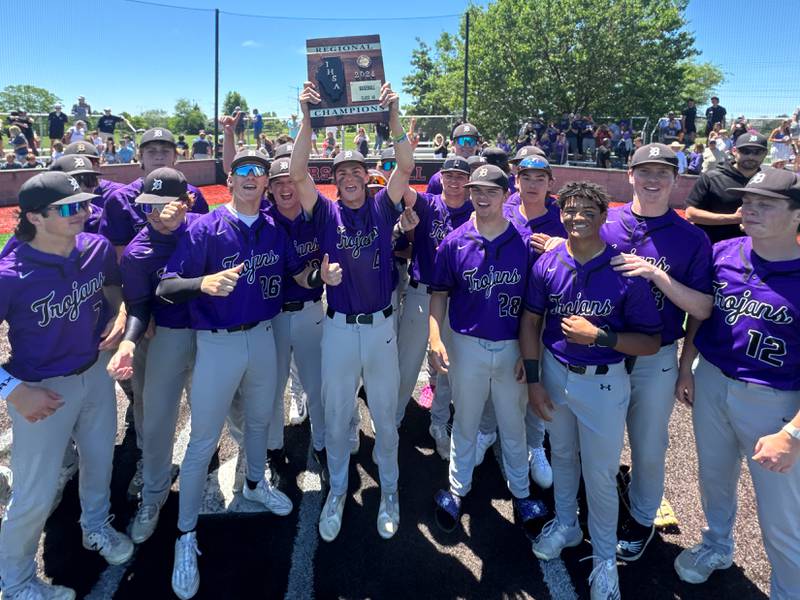 Downers Grove North players celebrate their victory over Oswego East to win the 4A Bolingbrook Regional Baseball Championship at Bolingbrook High School on Saturday, May 25, 2024.