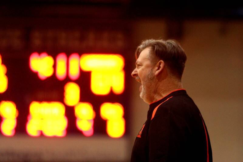 McHenry’s Head Coach Corky Card guides the Warriors against Kaneland in Hoops for Healing basketball tournament championship game action at Woodstock Wednesday.