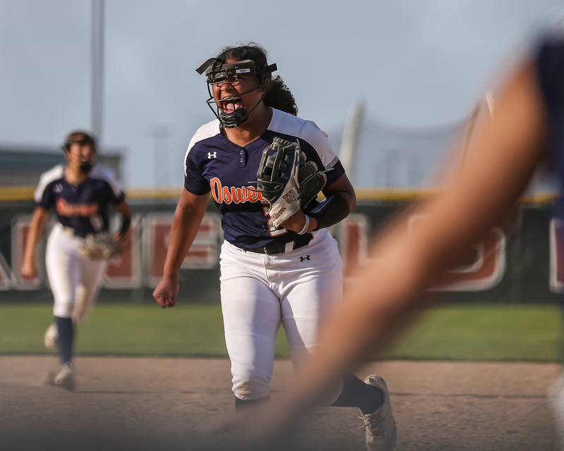 Oswego's Jaelynn Anthony (20) reacts after retiring the last batter in their Class 4A Plainfield North Sectional final softball game against Wheaton North.