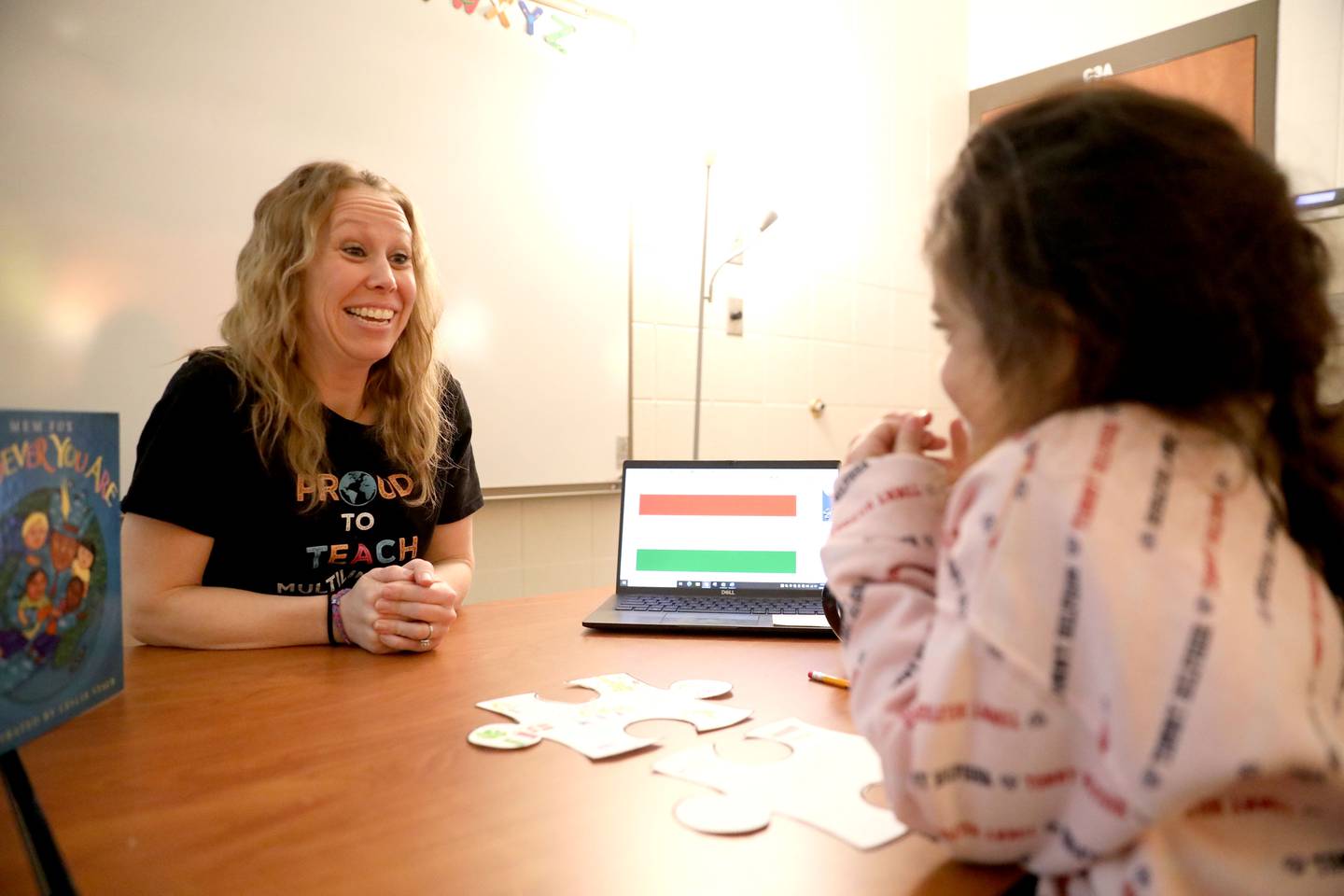 Abby Ortega, an English Language Learner teacher, works with Malika Khalilova at Corron Elementary School in South Elgin.