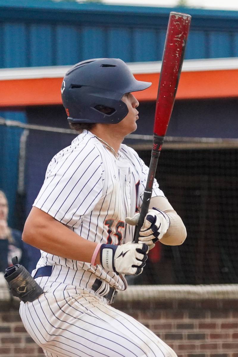 Oswego’s Donovan Williams (15) drives in a run against Oswego East during a baseball game at Oswego High School on Monday, May 13, 2024.