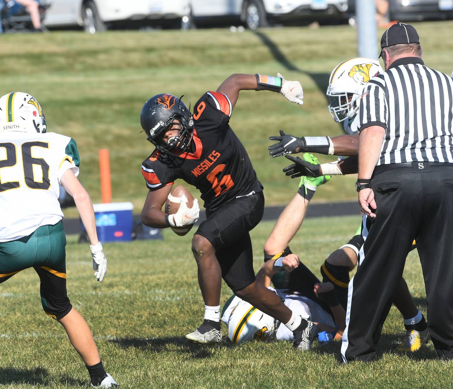 Milledgeville's Micah Toms-Smith runs for gain that was later called back for a holding during action against  St. Thomas More in 8-man football action ion Saturday, Oct. 22. The Missiles won the game 46-6.