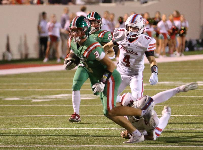 L-P's Michael Hartman breaks a tackle as Ottawa's Logan Mills chases after him on Friday, Sept. 13, 2024 at Howard Fellows Stadium.