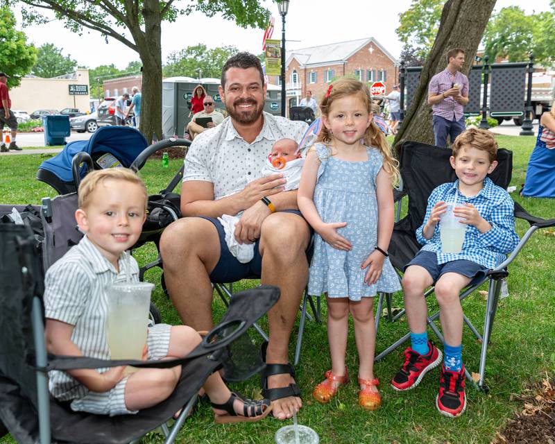 Joe Bloxham from Woodridge with his children (L to R) Wallace, Calvin, Josie and Frank at the Hinsdale 4th of July Family Celebration.  July 4th, 2024.