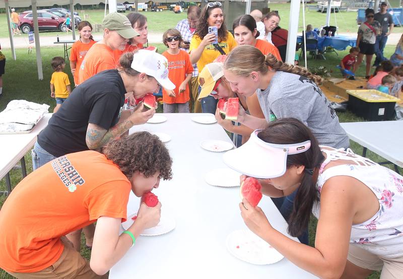 Adults chow down in the watermelon eating contest during the La Salle County 4-H Fair on Thursday, July 11, 2024 in Ottawa.