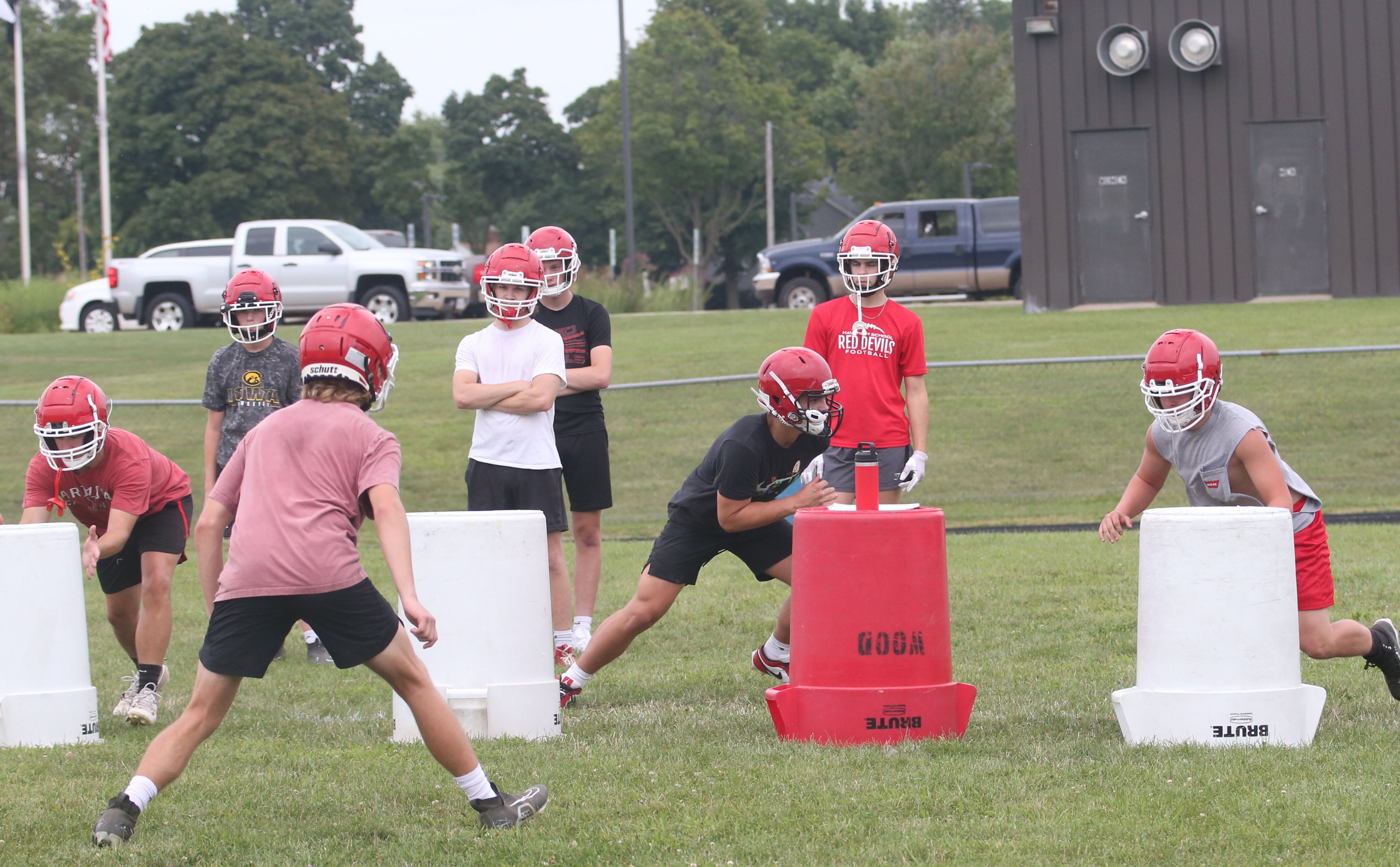 Members of the Hall football team run drills during the first day of practice on Monday, Aug. 12, 2024 at Hall High School.