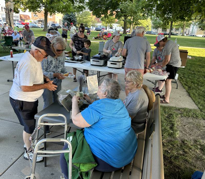 Volunteers from the Mount Morris Library sold food at the Rick Lindy and the Wild Ones concert during the Jamboree Music Series in Mount Morris on Friday, June 14, 2024. The free concerts are held each Friday evening during the summer in downtown Mount Morris with different concession providers each night.