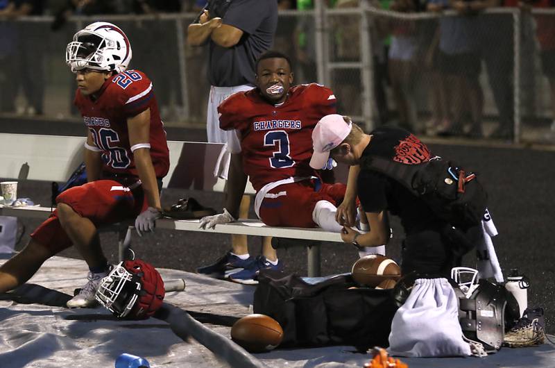 Dundee-Crown's Kadin Malone has a injury tended to during a Fox Valley Conference football game against Crystal Lake South on Friday, Aug 30, 2024, at Dundee-Crown High School in Carpentersville.