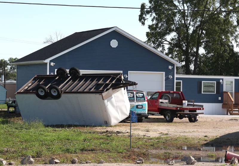 A trailer lies overturned Monday, July 15, 2024, at Cortland Coach and Camper Storage at the northeast corner of Route 38 and Somonauk Road in Cortland. High Winds and heavy storms hit DeKalb County overnight causing downed trees and power outages in the area.