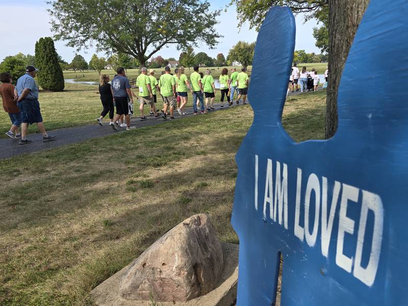 Walkers participate Sunday, Sept. 15, 2024, at the Compassionate Friends Walk to Remember at Baker Lake in Peru.