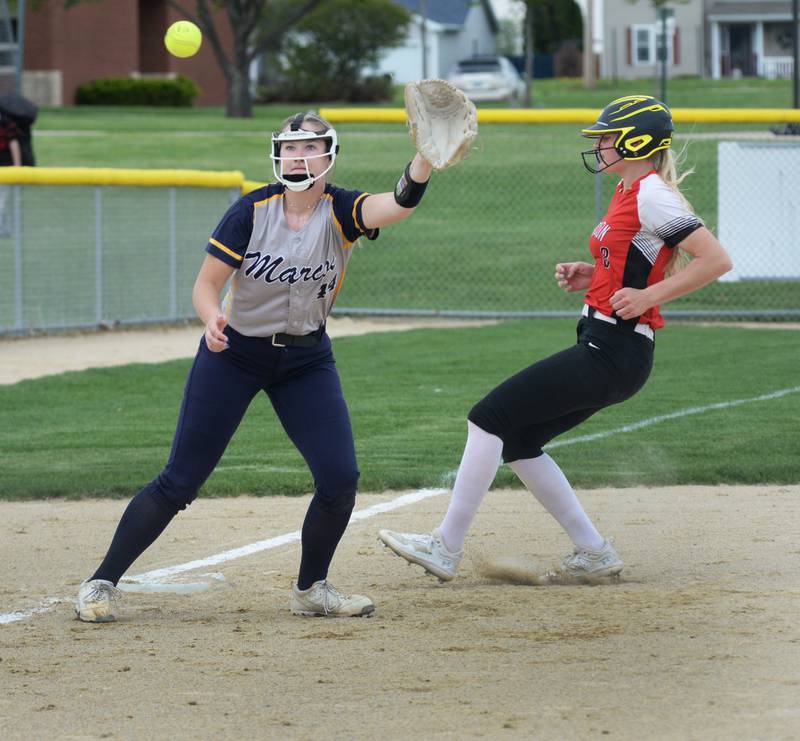 Polo third baseman Karlea Frey reaches for a throw as Forreston's Ella Ingram reaches the base safely during a Thursday, May 2, 2024 game at Forreston High School.