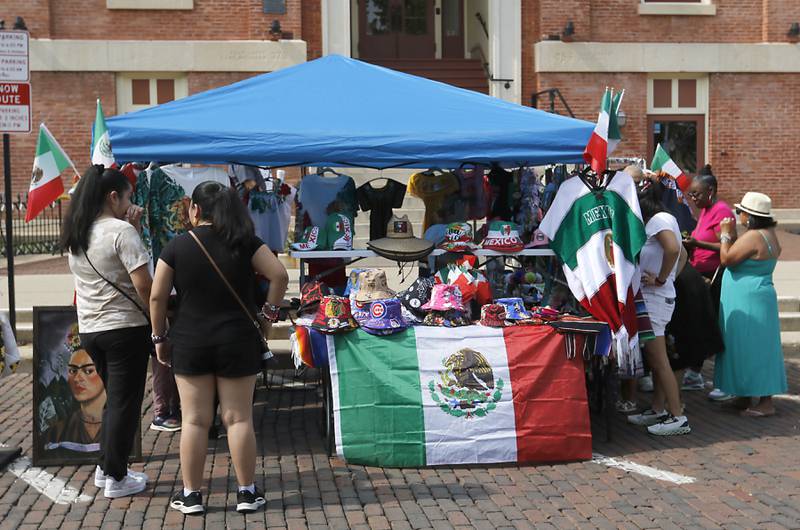 People shop during the annual Hispanic Connections Mexican Independence Day Celebration on Sunday, Sept. 15, 2024, in the Historic Woodstock Square. The celebration featured music, food and culture.