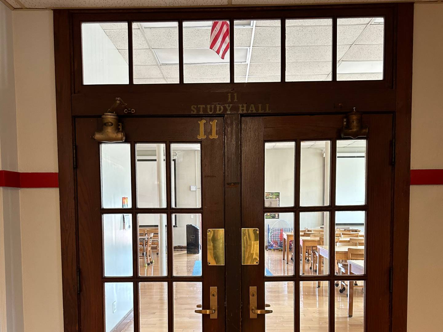 Interior doors at former Marengo High School, now Marengo 's Grant Elementary School and Middle School. The building's  100th birthday is being celebrated during Homecoming.