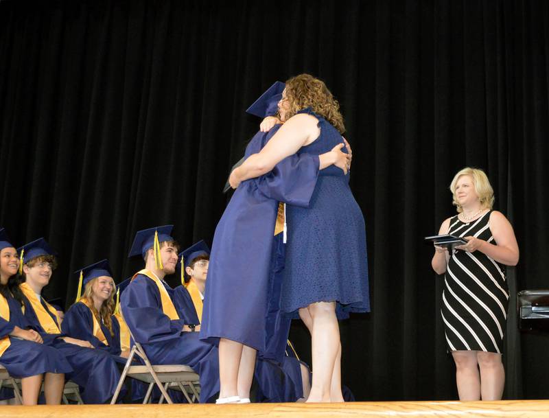 Polo Community High School senior Courtney Grobe hugs PCHS Board of Education member Jennifer Grobe during the Class of 2024's commencement ceremony on Sunday, May 19, 2024.