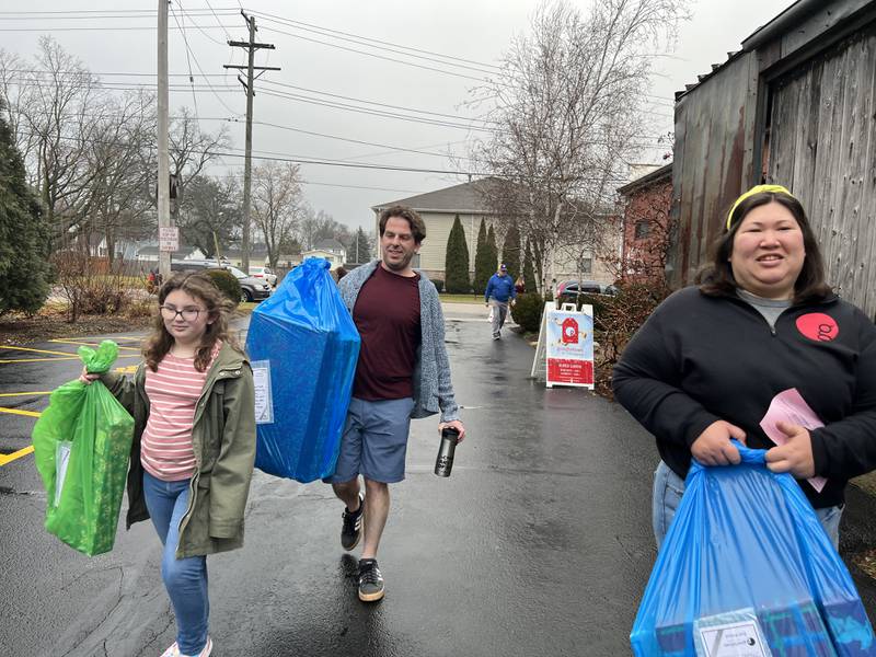 Everly Skudlarek, left, Dave Skudlarek and Kelli Meserole delivered Goodfellows gifts as a family on Dec. 24, 2023.