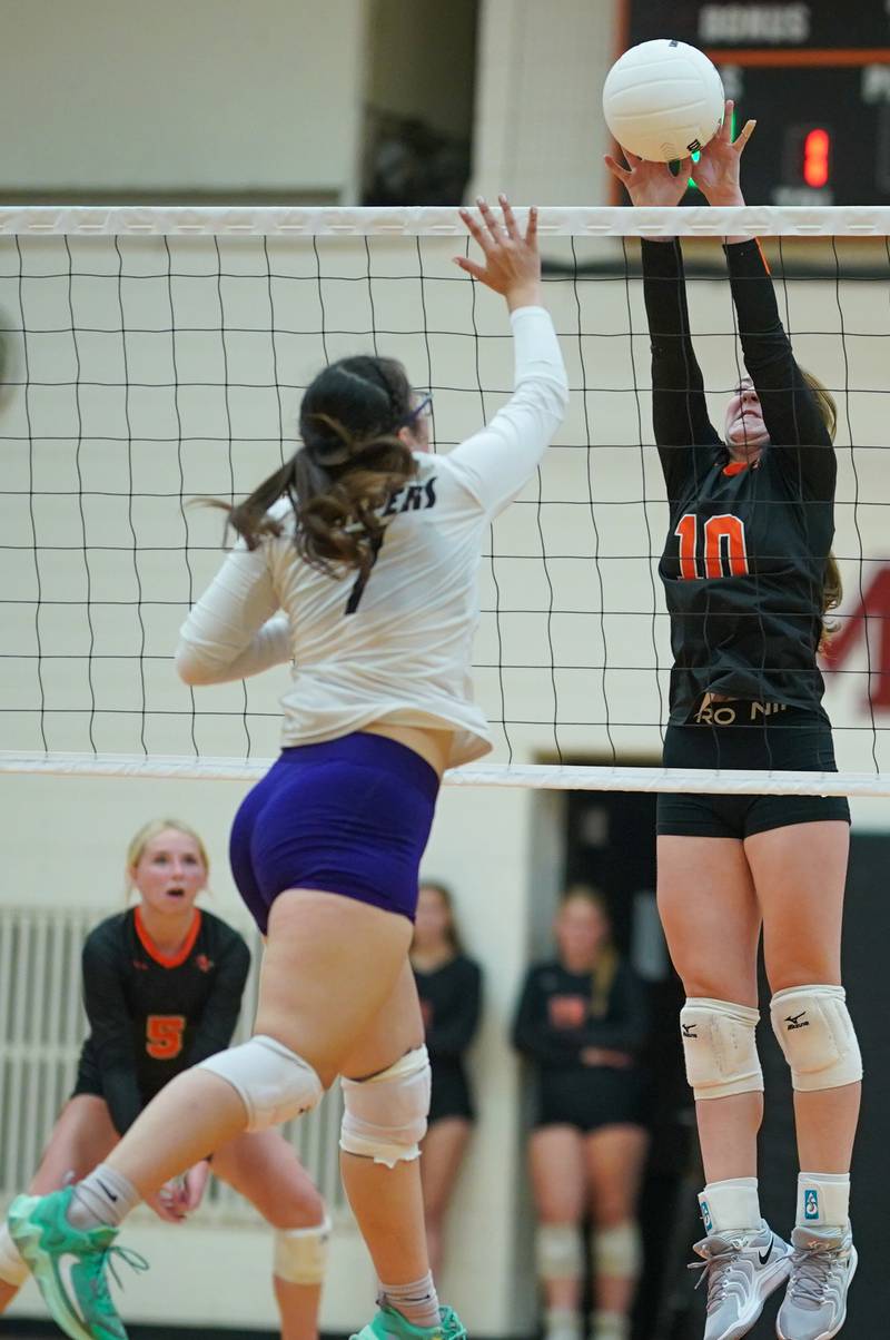 Sandwich’s Kayden Corneils (10) blocks a kill attempt by Plano’s Irene Isitt (7) during a volleyball match at Sandwich High School on Tuesday, Sep 10, 2024.