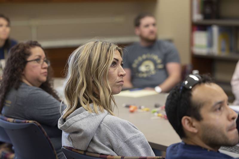 Sterling School’s paraprofessionals attend a meeting Friday, April 21, 2023. about SPS University, a program meant to fast track those who want to full time teachers.