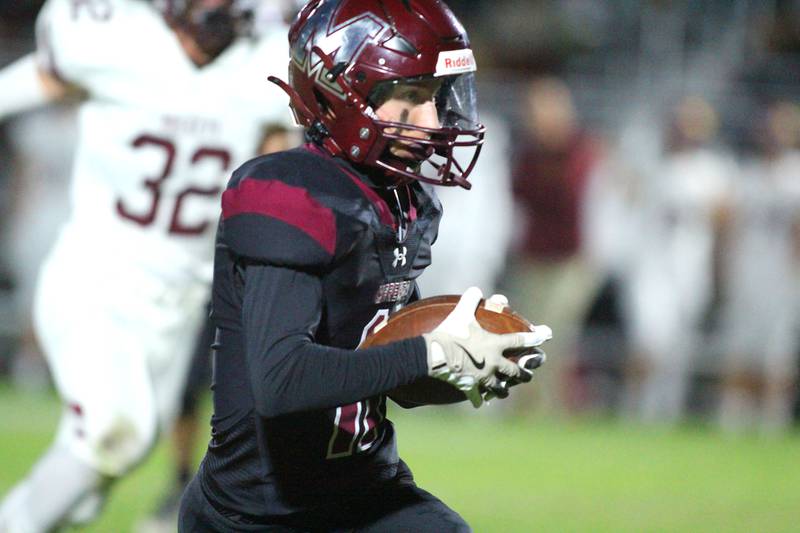 Marengo’s Alten Bergbreiter hustles toward the end zone with a touchdown against Richmond Burton in varsity football at Rod Poppe Field on the campus of Marengo High School in Marengo on Friday, Oct. 18, 2024.