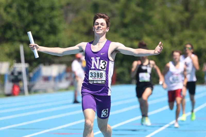 Downers Grove North’s Ryan Eddington celebrates a first place win in the Class 3A 4x800 Meter Relay State Championship on Saturday, May 25, 2024 in Charleston.