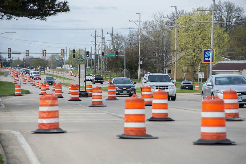 Cars pass through construction Wednesday, May 4, 2022 on East Lincolnway in Sterling.