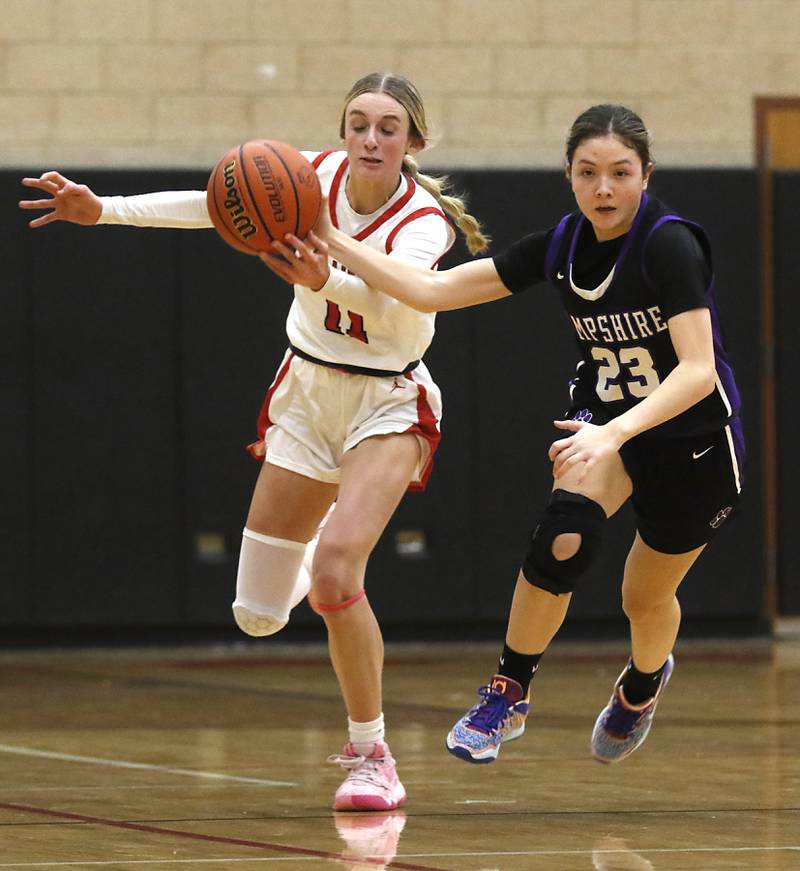 Huntley's Anna Campanelli tries to control the ball in front of Hampshire's Lia Saunders during a Fox Valley Conference girls basketball game Monday, Jan. 30, 2023, at Huntley High School.