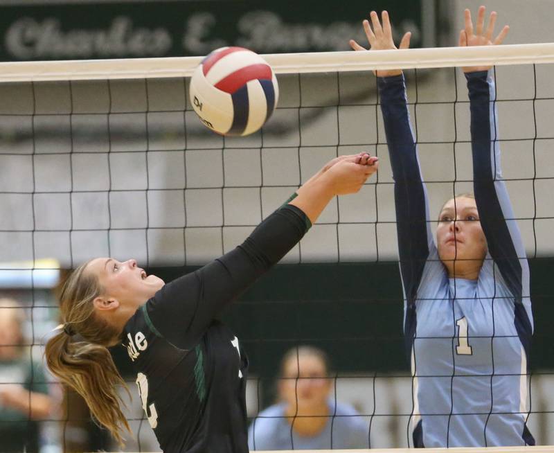 St. Bede's Sadie Koehler bumps the ball back to the center of the court as Bureau Valley's Kinley Canady watches on Monday, Sept. 9, 2024 at St. Bede Academy.