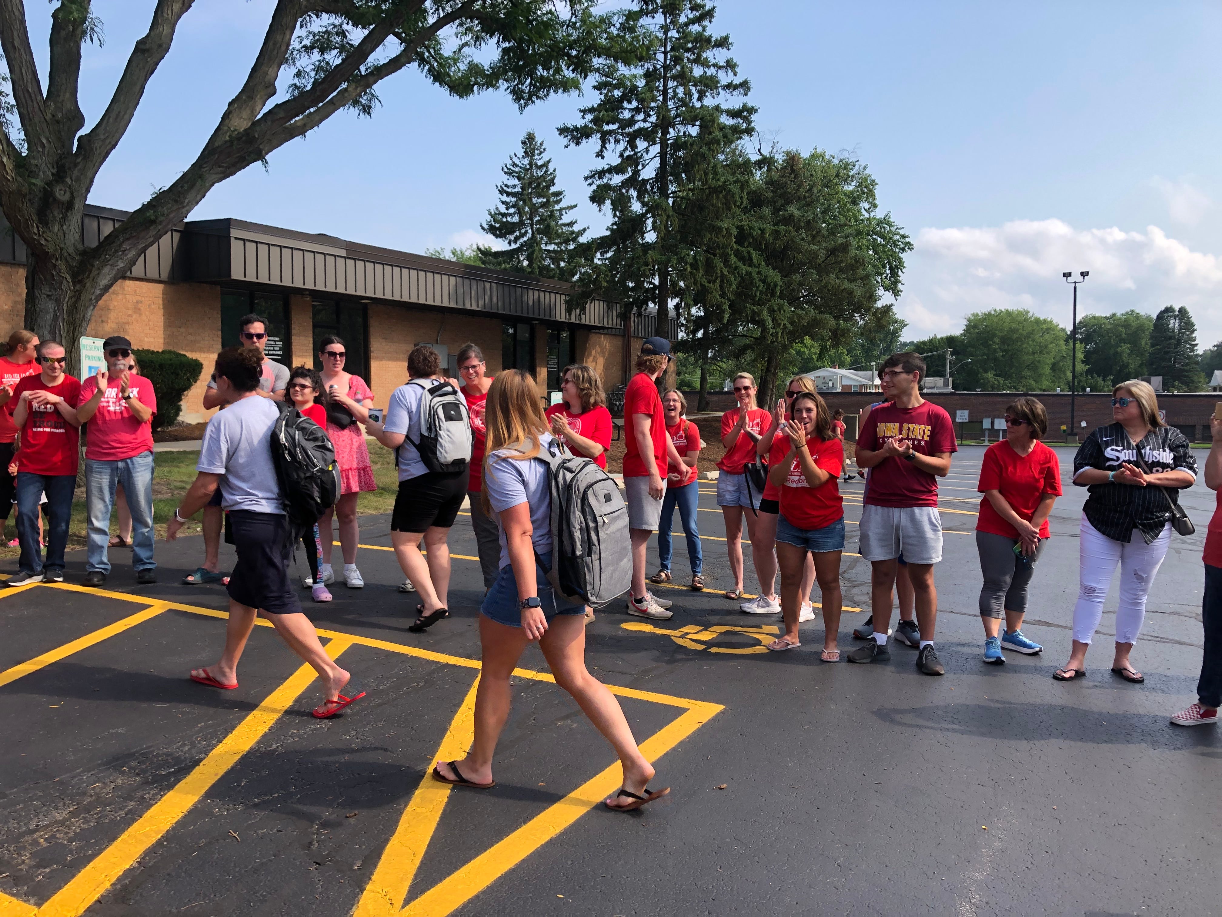 Members of the Crystal Lake Elementary Teachers Union negotiating team are cheered on as they walk into the District 47 office Aug. 5, 2024.