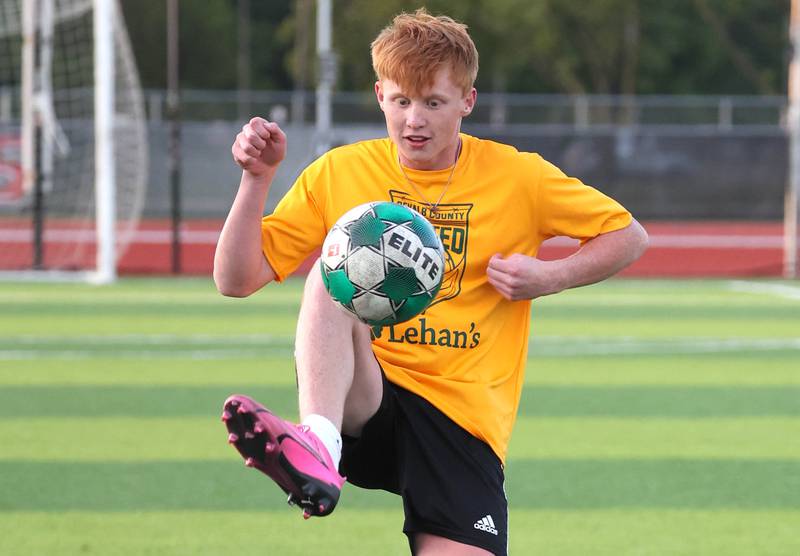 DeKalb County United’s Carl Jameson, from Sycamore, kicks the ball Thursday, June 6, 2024, during practice at the Northern Illinois University Soccer and Track and Field Complex in DeKalb.