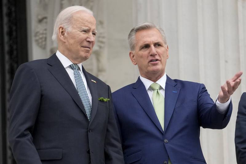 FILE - President Joe Biden talks with House Speaker Kevin McCarthy of Calif., on the House steps as they leave after attending an annual St. Patrick's Day luncheon gathering at the Capitol in Washington, Friday, March 17, 2023. Facing the risk of a government default as soon as June 1, President Joe Biden has invited the top four congressional leaders to a White House meeting for talks on Tuesday, May 9.