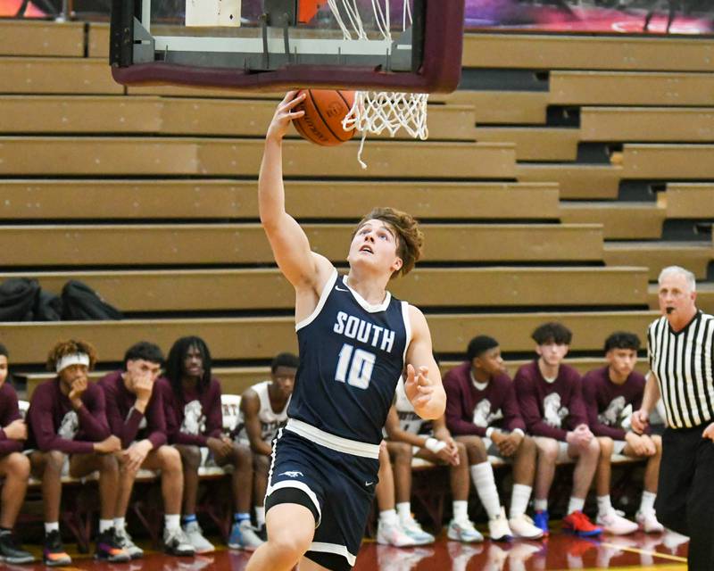 Downers Grove South's Dominic Marcantelli (10) makes a basket in the first quarter on Saturday Dec. 9, 2023, while taking on Morton East at Morton East High School.