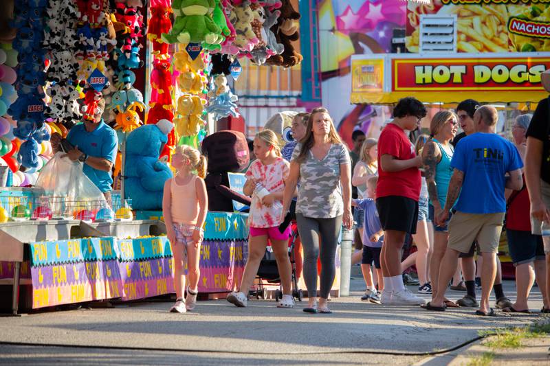 People of Ottawa walk through the fair on Friday, June 21, 2024 in Ottawa.